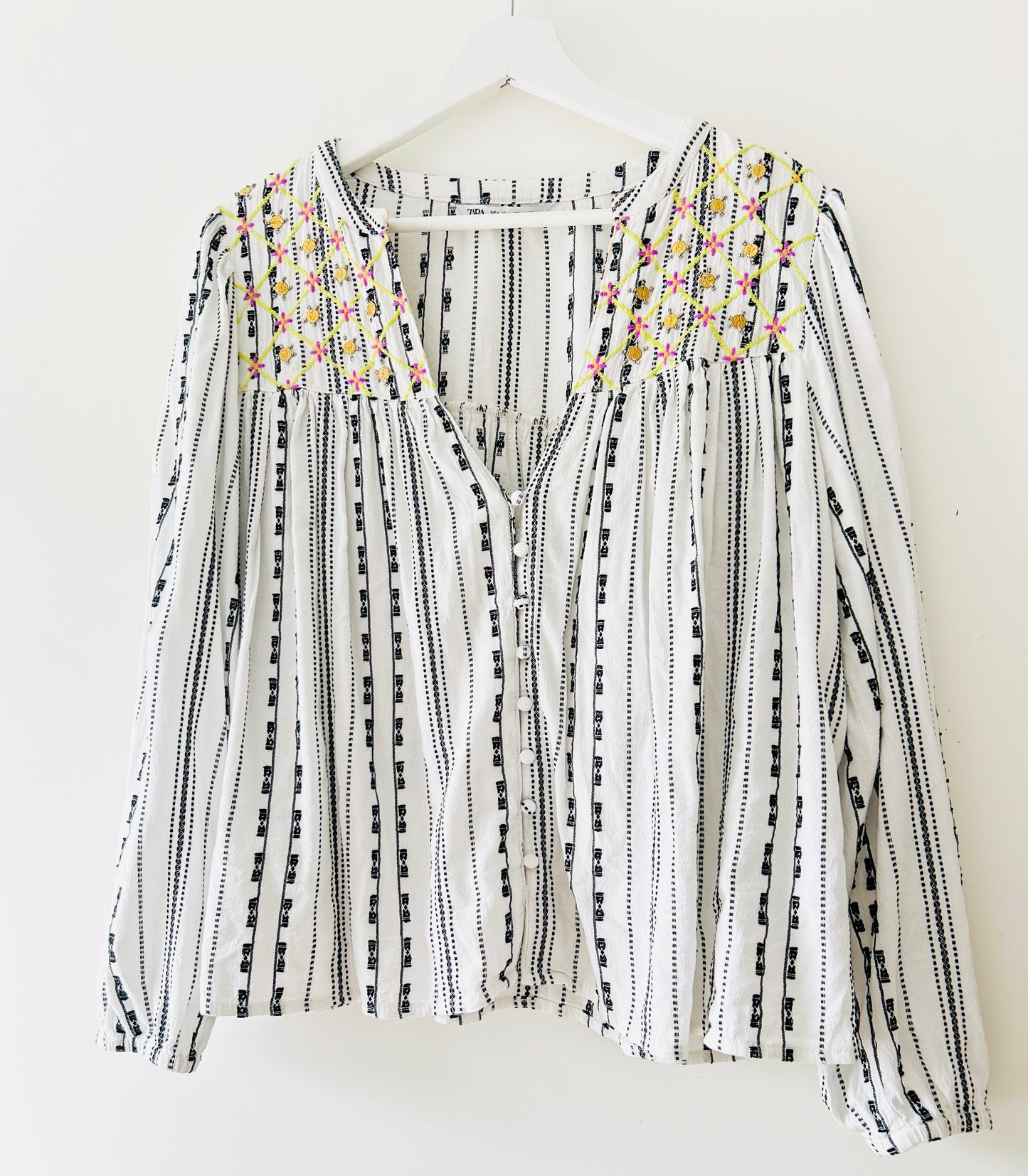 Black and white blouse with embroidery and gold coins