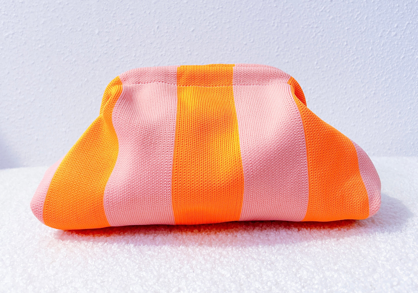 Pastelroze/oranje gestreepte gebreide toilettas
