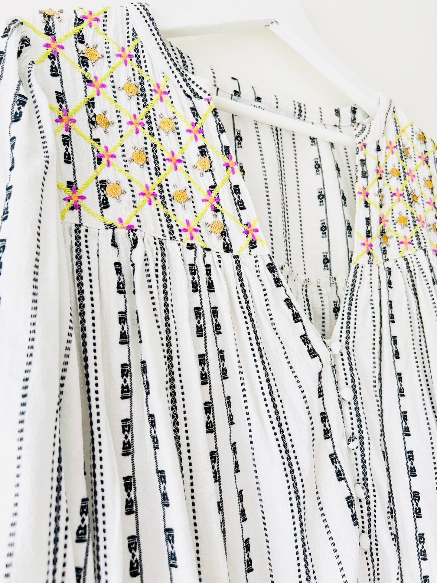 Black and white blouse with embroidery and gold coins
