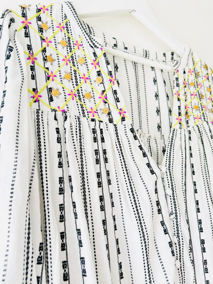 Black and white blouse with embroidery and gold coins