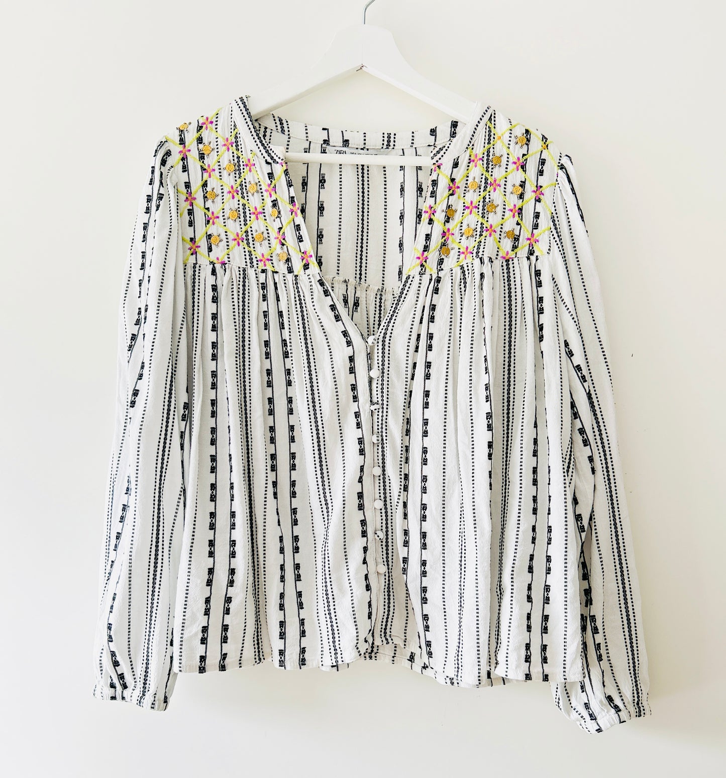 Black and white blouse with embroidery and gold coins